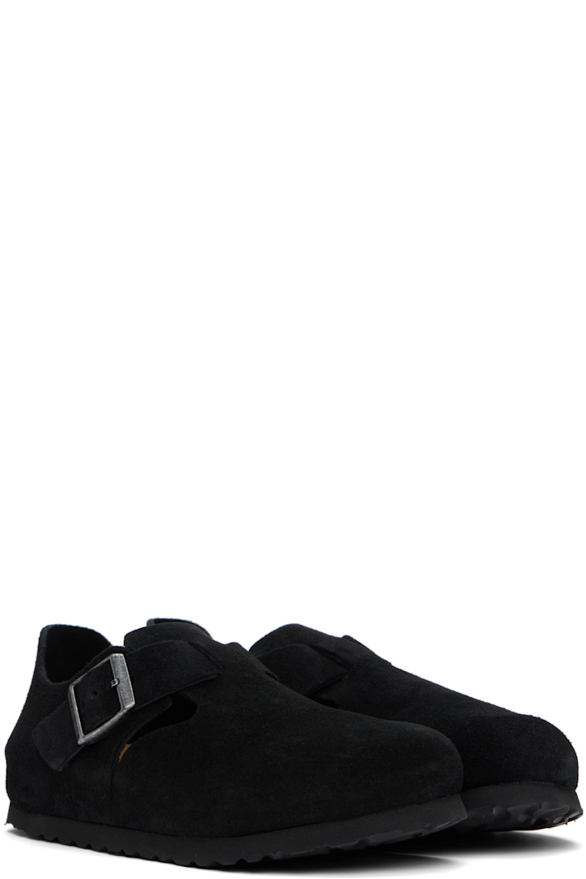 Suede loafers in black.

· Pin-buckle strap at vamp
· Logo embossed at inner side
· Suede lining
· Cork-latex midsole
· Treaded rubber sole
· Logo-engraved antiqued silver-tone hardware

Supplier color: Black suede