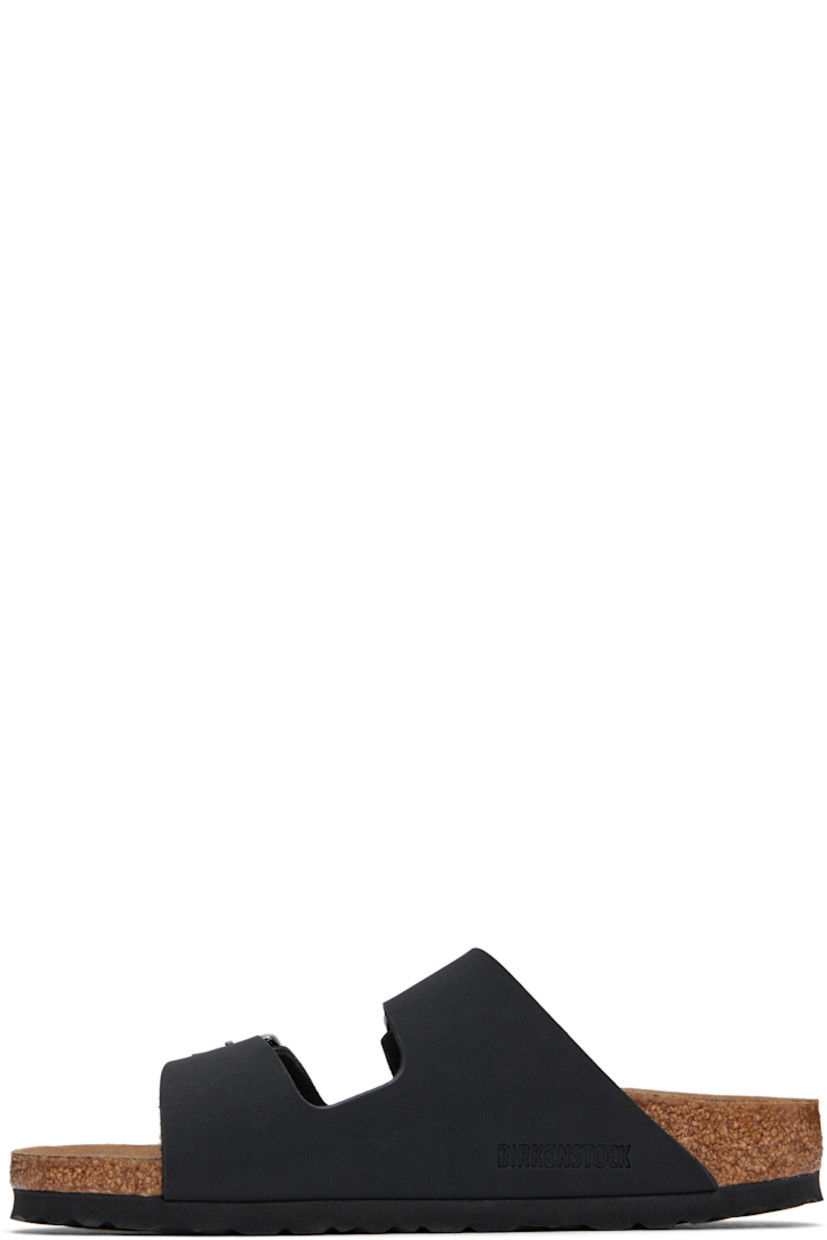 Buffed Birkibuc® faux-leather slip-on sandals in black.

· Open toe
· Pin-buckle straps at vamp
· Logo embossed at inner side
· Logo printed at molded footbed
· Microfiber lining
· Cork-latex midsole
· Treaded rubber sole
· Logo-engraved antiqued silver-tone hardware

Supplier color: Black