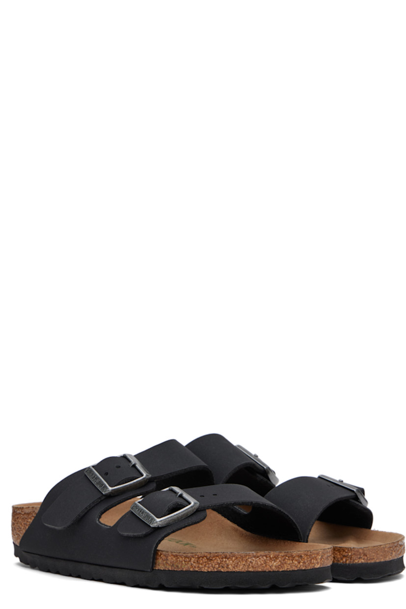 Buffed Birkibuc® faux-leather slip-on sandals in black.

· Open toe
· Pin-buckle straps at vamp
· Logo embossed at inner side
· Logo printed at molded footbed
· Microfiber lining
· Cork-latex midsole
· Treaded rubber sole
· Logo-engraved antiqued silver-tone hardware

Supplier color: Black