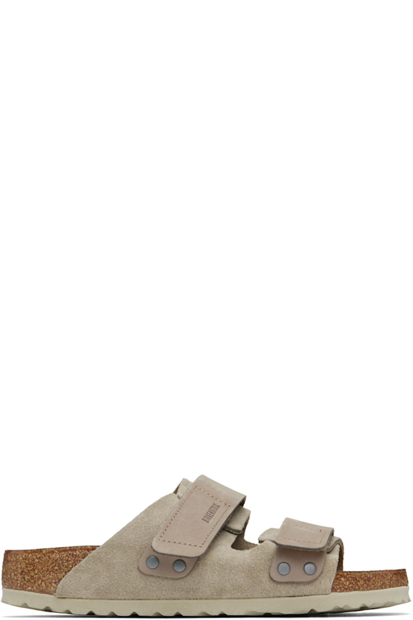 Suede and nubuck slip-on sandals in taupe.

· Open toe
· Velcro straps at vamp
· Logo embossed at strap and inner side
· Logo printed at molded footbed
· Suede lining
· Cork-latex midsole
· Treaded rubber sole

Supplier color: Taupe