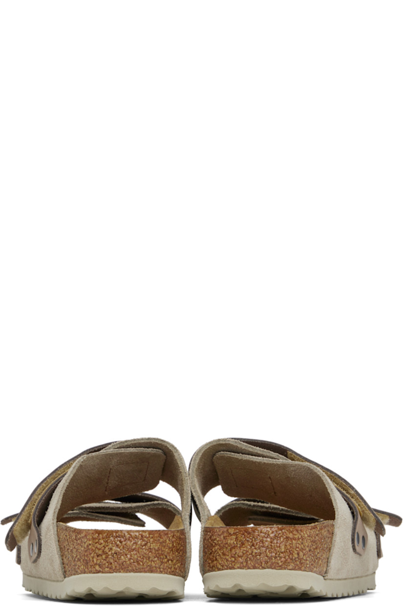 Suede and nubuck slip-on sandals in taupe.

· Open toe
· Velcro straps at vamp
· Logo embossed at strap and inner side
· Logo printed at molded footbed
· Suede lining
· Cork-latex midsole
· Treaded rubber sole

Supplier color: Taupe