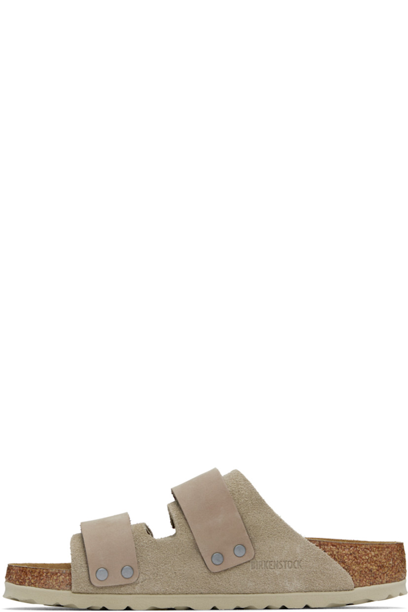 Suede and nubuck slip-on sandals in taupe.

· Open toe
· Velcro straps at vamp
· Logo embossed at strap and inner side
· Logo printed at molded footbed
· Suede lining
· Cork-latex midsole
· Treaded rubber sole

Supplier color: Taupe