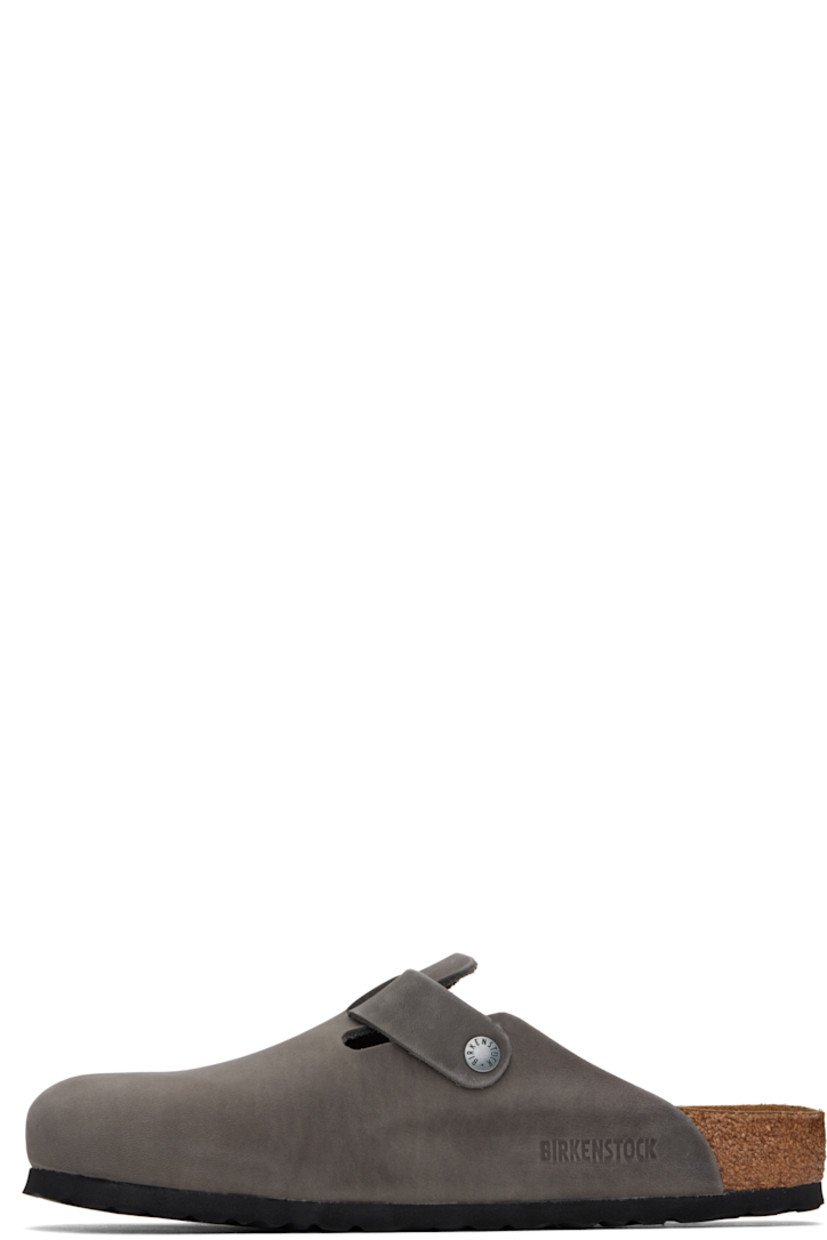 Oiled and waxed leather slip-on loafers in gray.

· Pin-buckle strap at vamp
· Logo embossed at inner side
· Logo printed at molded footbed
· Suede lining
· Cork-latex midsole
· Treaded rubber sole
· Logo-engraved antiqued gunmetal-tone hardware

Supplier color: Iron