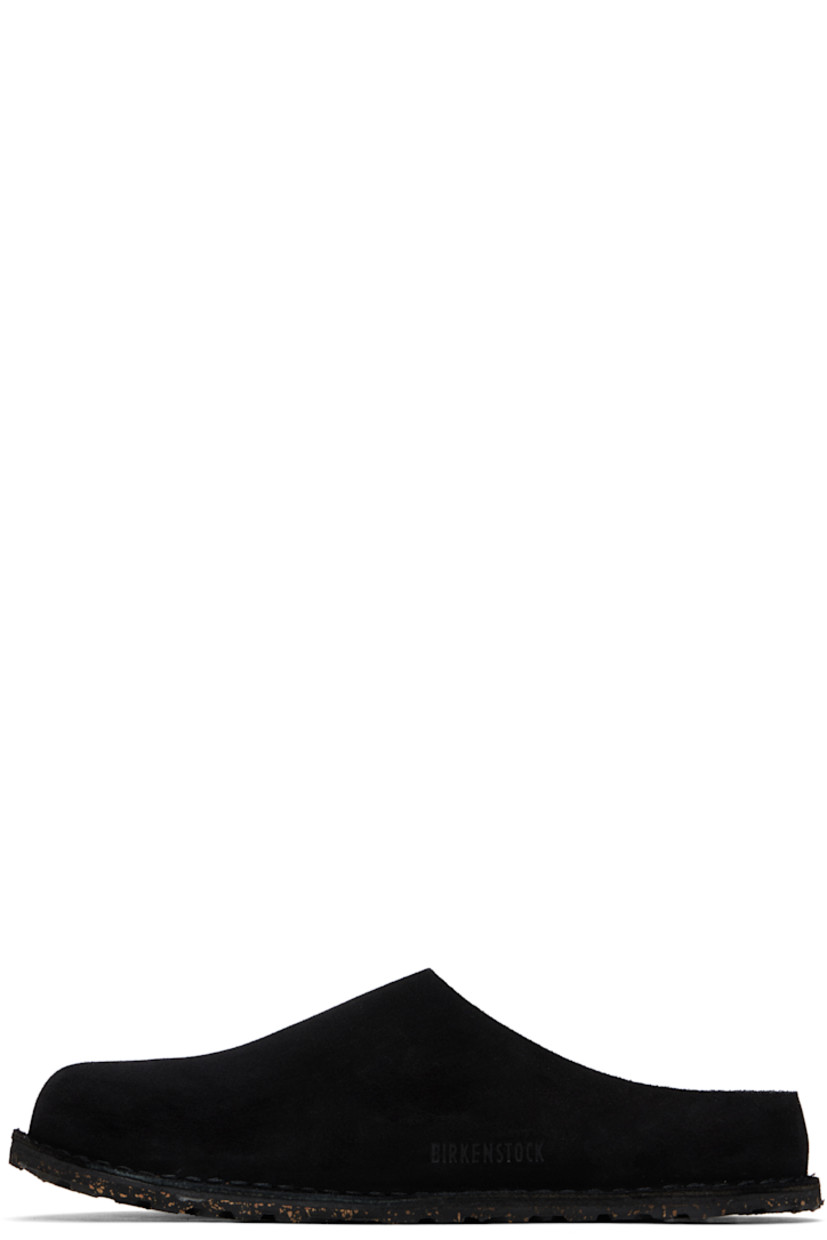 Suede loafers in black.

· Logo rivet at vamp
· Pinched seam at outer side
· Logo printed at molded suede footbed
· Cork-latex midsole
· Treaded rubber sole
· Logo-engraved gunmetal-tone hardware

Supplier color: Black suede