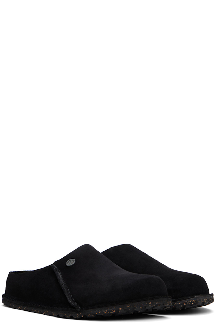 Suede loafers in black.

· Logo rivet at vamp
· Pinched seam at outer side
· Logo printed at molded suede footbed
· Cork-latex midsole
· Treaded rubber sole
· Logo-engraved gunmetal-tone hardware

Supplier color: Black suede