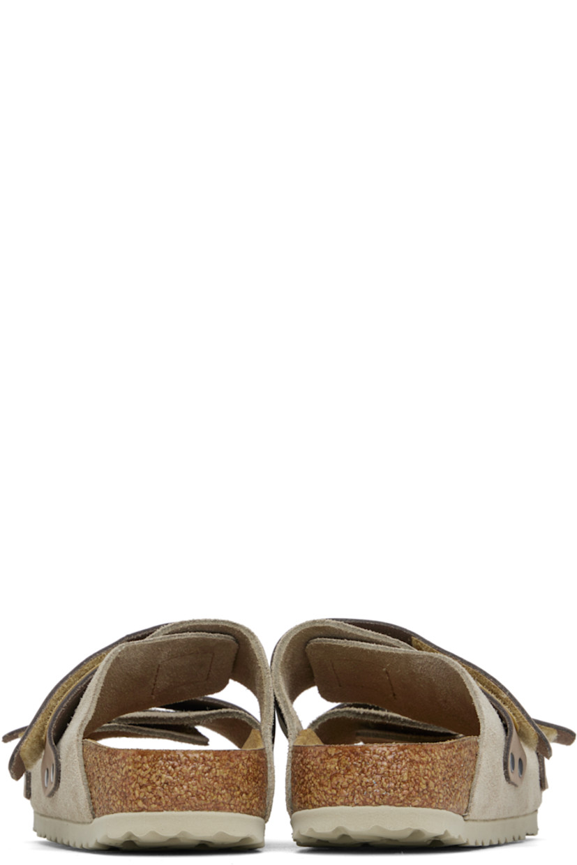 Suede and nubuck slip-on sandals in taupe.

· Open toe
· Velcro straps at vamp
· Logo embossed at strap and inner side
· Logo printed at molded footbed
· Suede lining
· Cork-latex midsole
· Treaded rubber sole

Supplier color: Taupe