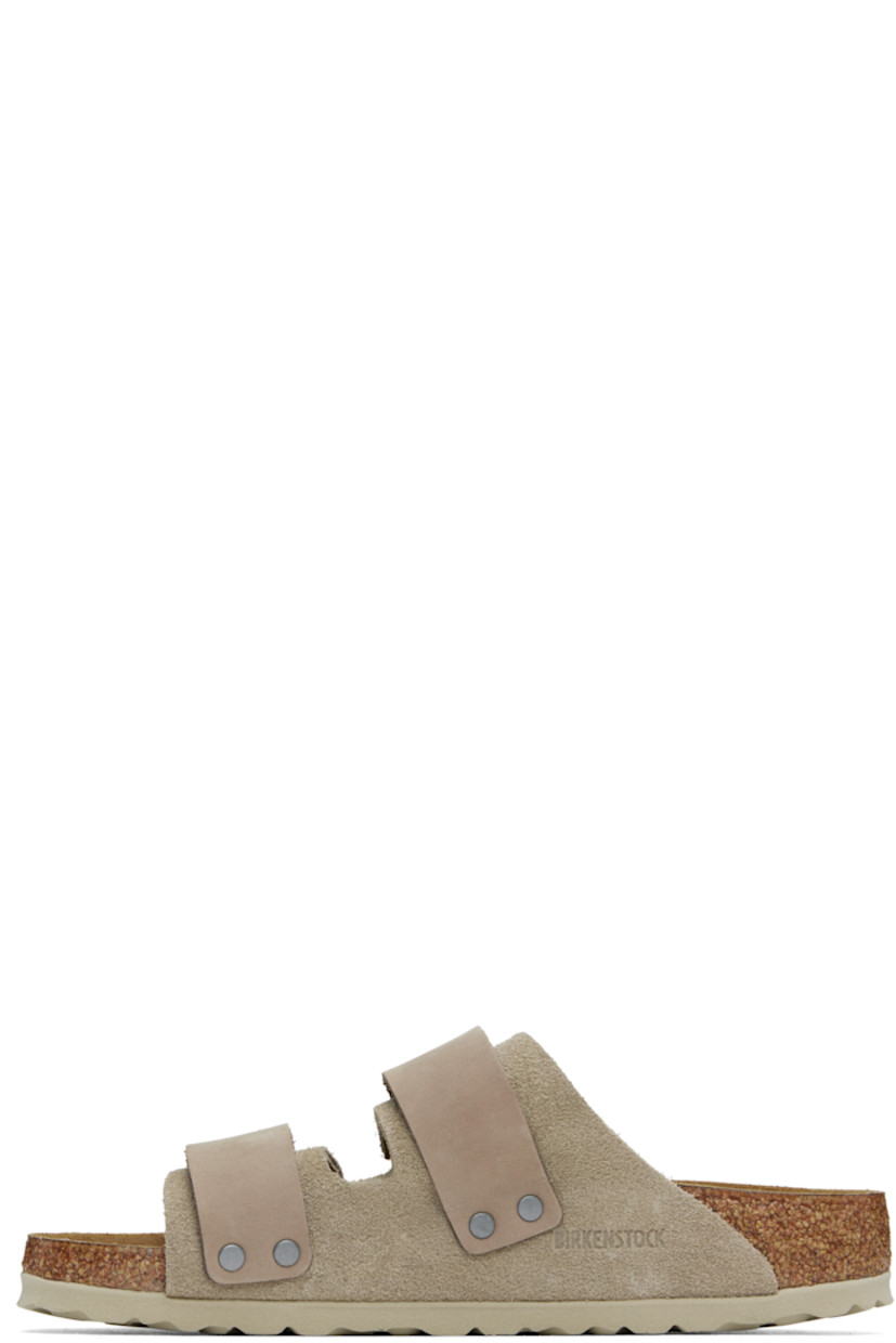 Suede and nubuck slip-on sandals in taupe.

· Open toe
· Velcro straps at vamp
· Logo embossed at strap and inner side
· Logo printed at molded footbed
· Suede lining
· Cork-latex midsole
· Treaded rubber sole

Supplier color: Taupe