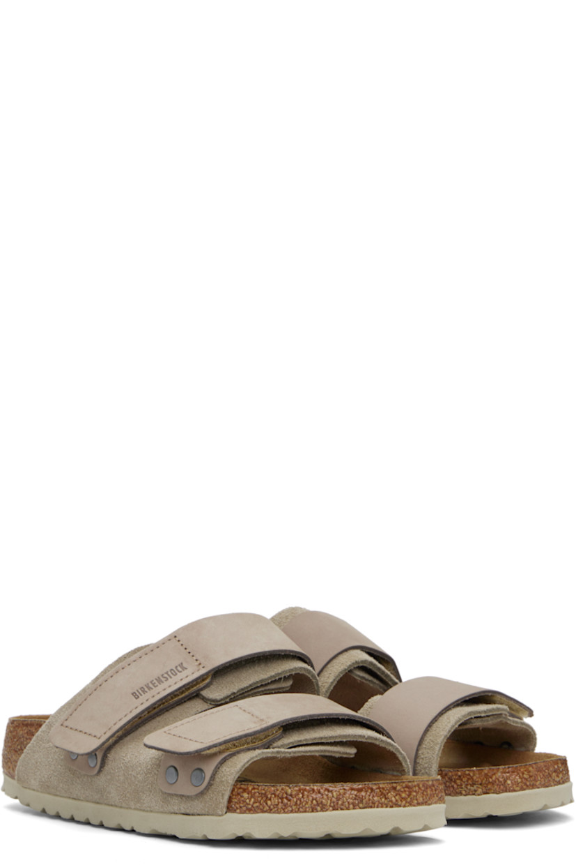 Suede and nubuck slip-on sandals in taupe.

· Open toe
· Velcro straps at vamp
· Logo embossed at strap and inner side
· Logo printed at molded footbed
· Suede lining
· Cork-latex midsole
· Treaded rubber sole

Supplier color: Taupe