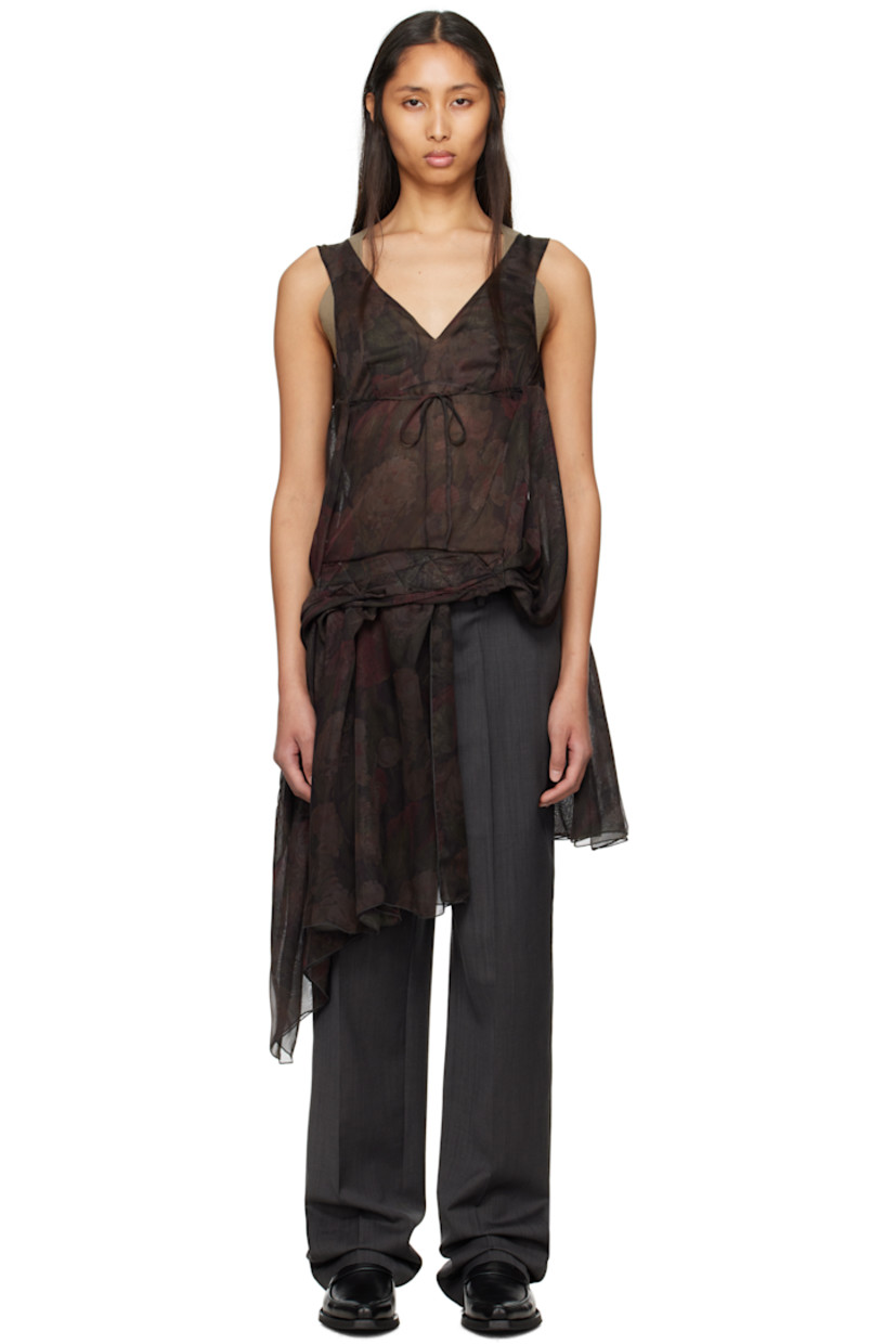 Semi-sheer polyester chiffon top. Floral pattern printed throughout.

· Plunging V-neck
· Gathered extended trim at hem and back
· Self-tie fastening at open back
· Velcro trim at interior for alternate styling

Virgin wool delaine trousers.

· Belt loops
· Velcro trim at interior waistband for alternate styling
· Four-pocket styling
· Zip fly
· Creased legs
· Unfinished hem

Supplier color: Gray