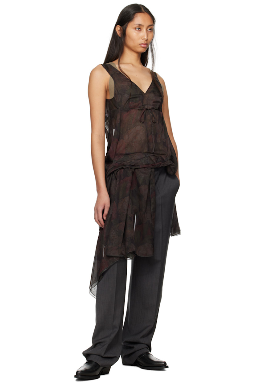 Semi-sheer polyester chiffon top. Floral pattern printed throughout.

· Plunging V-neck
· Gathered extended trim at hem and back
· Self-tie fastening at open back
· Velcro trim at interior for alternate styling

Virgin wool delaine trousers.

· Belt loops
· Velcro trim at interior waistband for alternate styling
· Four-pocket styling
· Zip fly
· Creased legs
· Unfinished hem

Supplier color: Gray