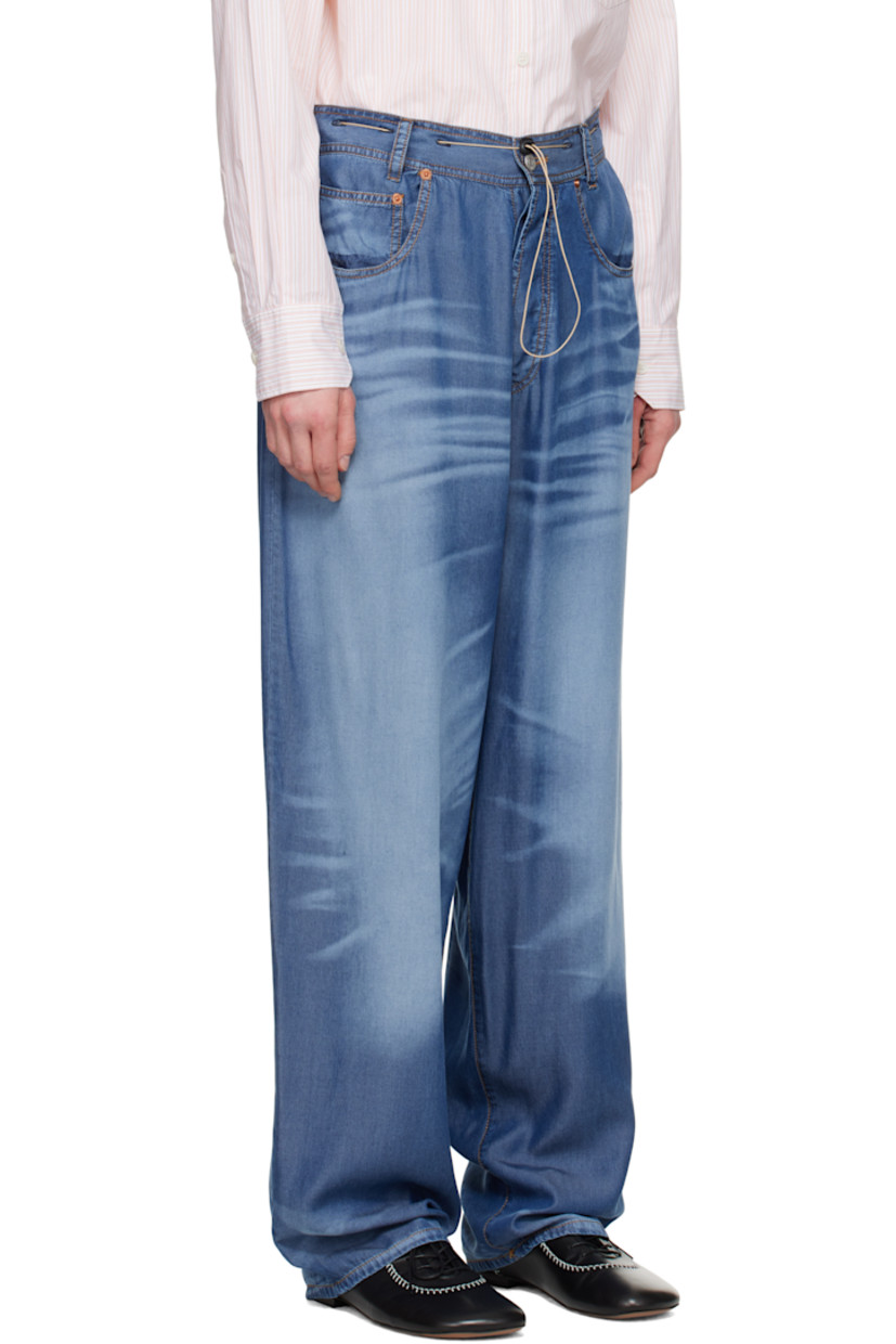 Loose-fit and lightweight lyocell twill pyjama pants. Trompe l'oeil denim graphic printed throughout.

· Belt loops and bungee-style drawstring at waistband
· Five-pocket styling
· Button-fly
· Logo engraved silver- and bronze-tone hardware
· Contrast stitching in tan

Supplier color: Indigo