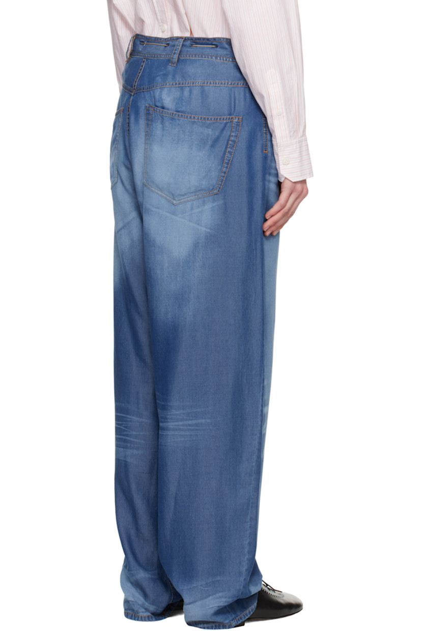 Loose-fit and lightweight lyocell twill pyjama pants. Trompe l'oeil denim graphic printed throughout.

· Belt loops and bungee-style drawstring at waistband
· Five-pocket styling
· Button-fly
· Logo engraved silver- and bronze-tone hardware
· Contrast stitching in tan

Supplier color: Indigo