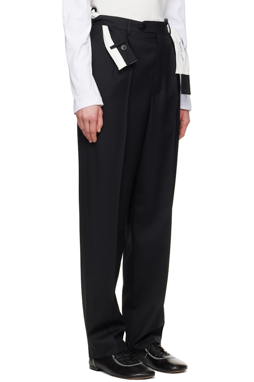 Virgin wool twill trousers. Logo-woven trim at integrated and twisted button fastening belt. 

· Belt loops 
· Four-pocket styling
· Zip fly
· Pleats at front
· Creased legs 
· Partial cotton poplin lining

Supplier color: Black