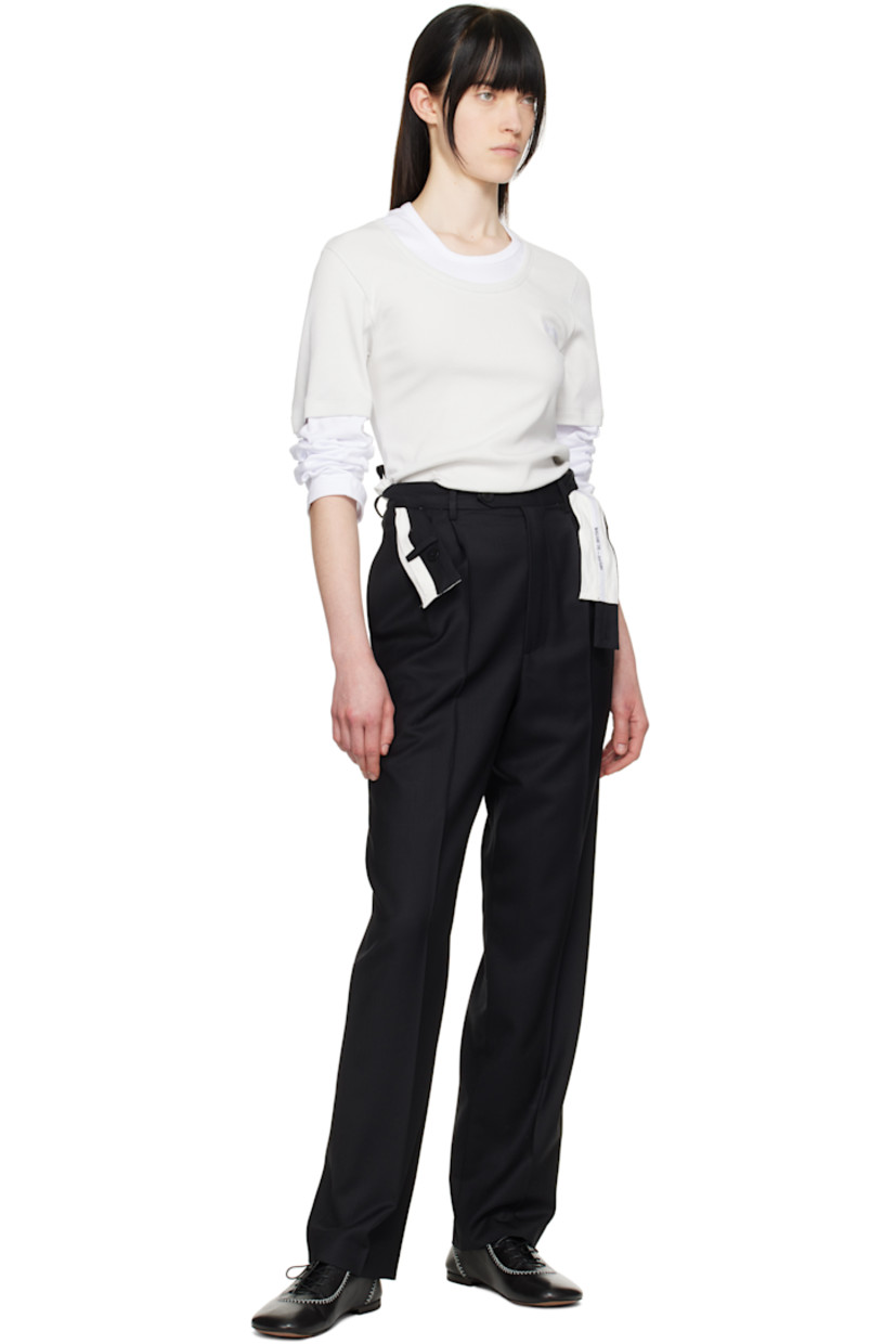 Virgin wool twill trousers. Logo-woven trim at integrated and twisted button fastening belt. 

· Belt loops 
· Four-pocket styling
· Zip fly
· Pleats at front
· Creased legs 
· Partial cotton poplin lining

Supplier color: Black