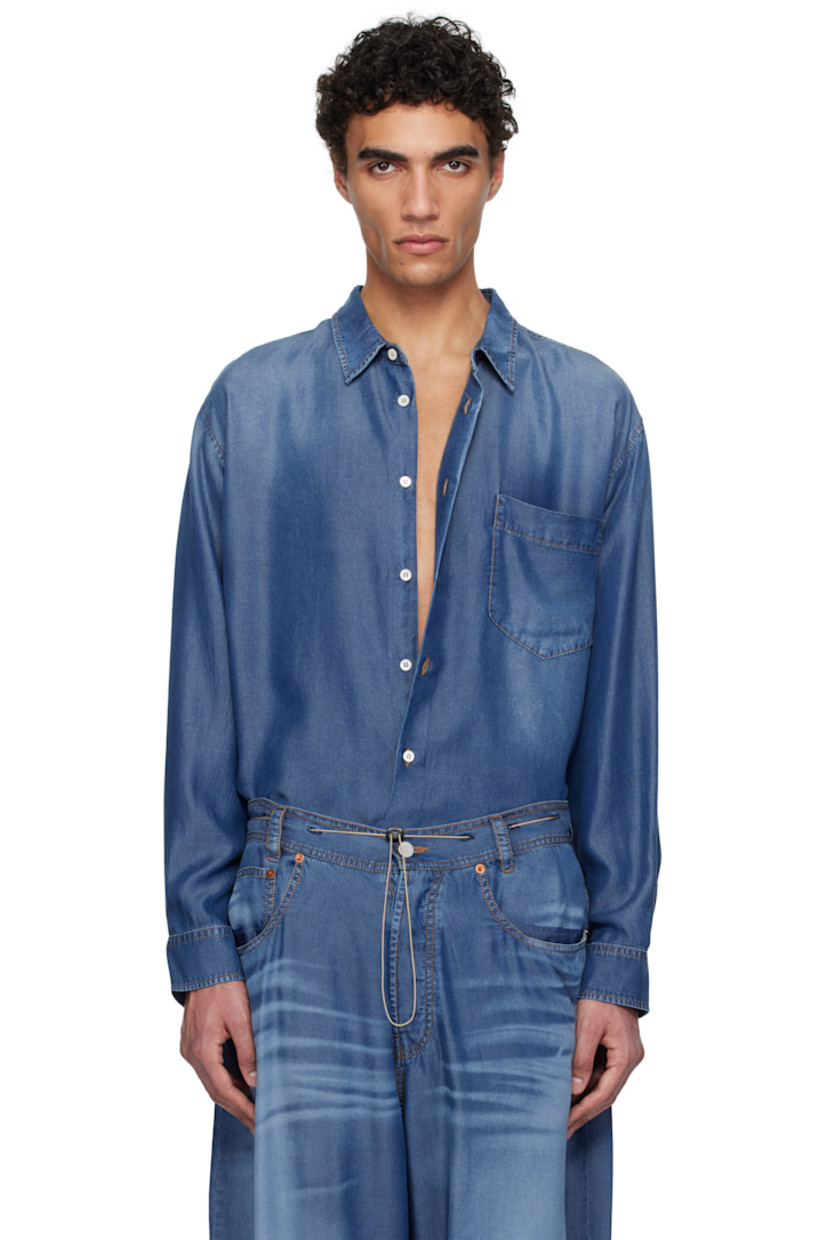 Lightweight lyocell twill shirt. Trompe-l'œil denim pattern printed throughout.

· Spread collar
· Button closure
· Patch pocket at chest
· Buttoned barrel cuffs
· Pleats at back yoke 
· Adjustable button tabs at back hem 
· Contrast stitching in tan

Supplier color: Indigo