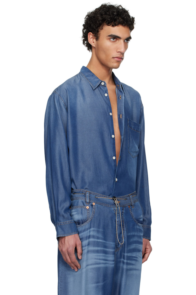 Lightweight lyocell twill shirt. Trompe-l'œil denim pattern printed throughout.

· Spread collar
· Button closure
· Patch pocket at chest
· Buttoned barrel cuffs
· Pleats at back yoke 
· Adjustable button tabs at back hem 
· Contrast stitching in tan

Supplier color: Indigo