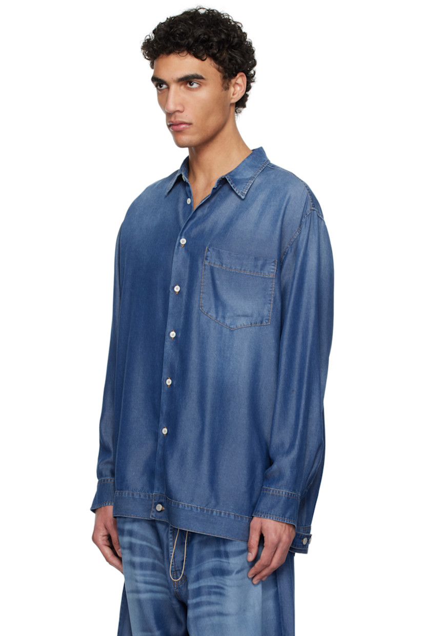 Lightweight lyocell twill shirt. Trompe-l'œil denim pattern printed throughout.

· Spread collar
· Button closure
· Patch pocket at chest
· Buttoned barrel cuffs
· Pleats at back yoke 
· Adjustable button tabs at back hem 
· Contrast stitching in tan

Supplier color: Indigo