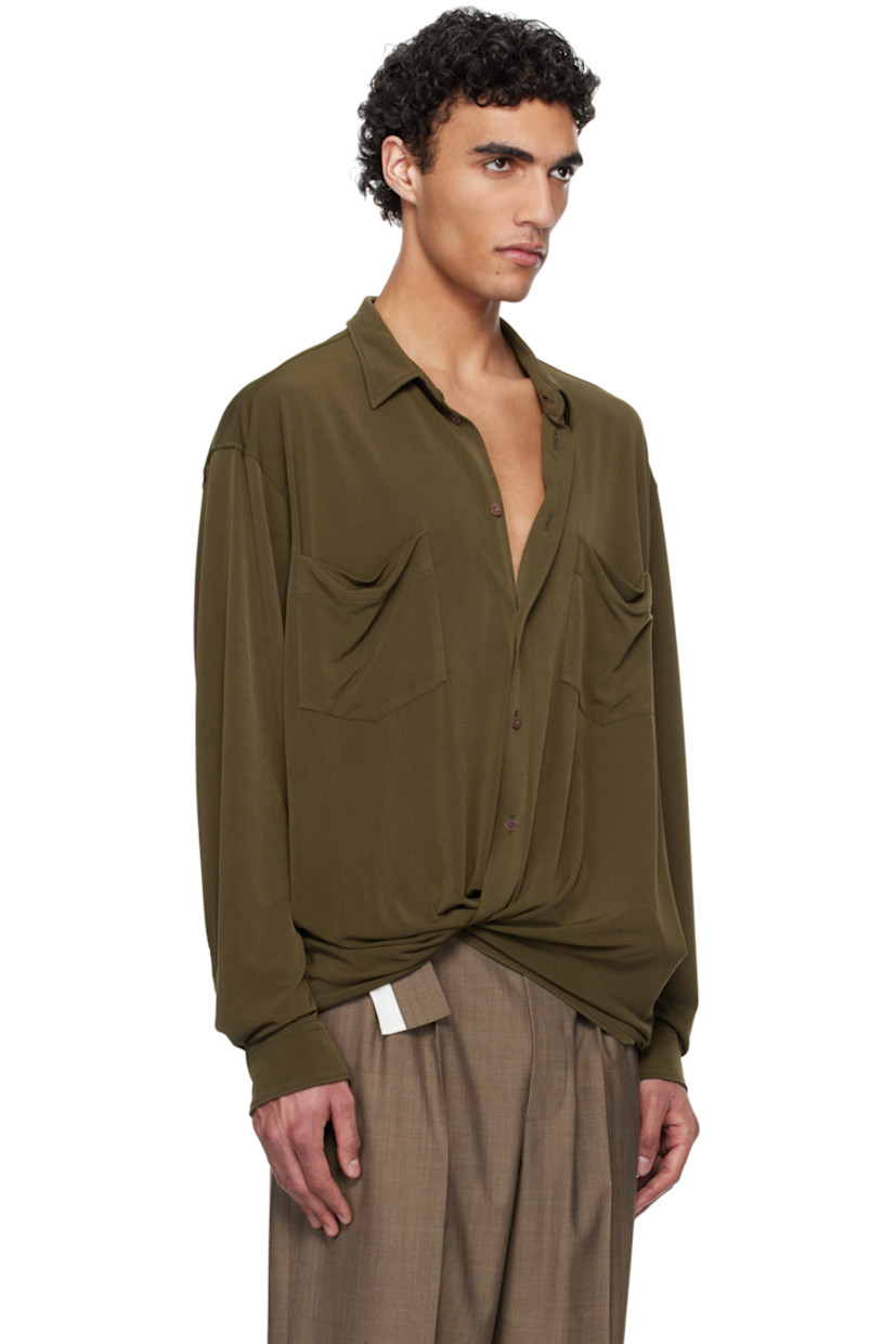 Stretch polyester jersey shirt.

· Spread collar
· Button closure
· Patch pockets
· Buttoned barrel cuffs
· Box pleat at back yoke

Supplier color: Military green
