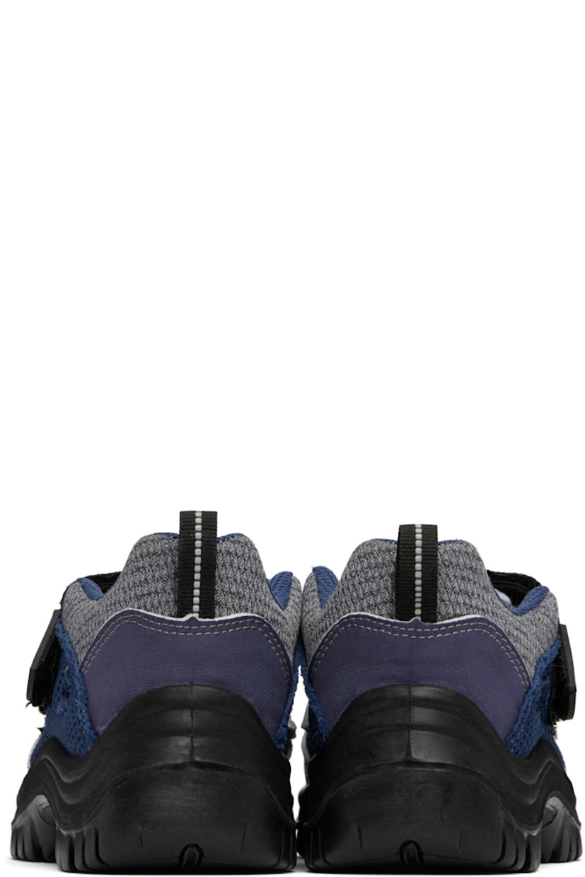 Low-top paneled knit, canvas, and mesh sneakers in tones of blue. 

· Abrasion- and oil-resistant
· Anti-slip and anti-static 
· Perforations at toe
· Logo patch at velcro closure
· Padded tongue and collar
· Pull-loop at heel collar
· Cutouts at sides
· Treaded rubber sole 

Supplier color: Dark mix