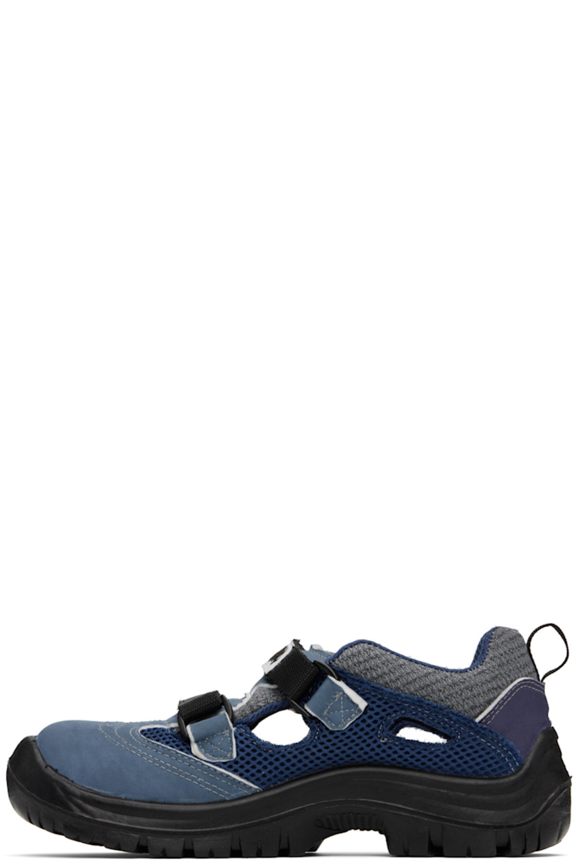Low-top paneled knit, canvas, and mesh sneakers in tones of blue. 

· Abrasion- and oil-resistant
· Anti-slip and anti-static 
· Perforations at toe
· Logo patch at velcro closure
· Padded tongue and collar
· Pull-loop at heel collar
· Cutouts at sides
· Treaded rubber sole 

Supplier color: Dark mix
