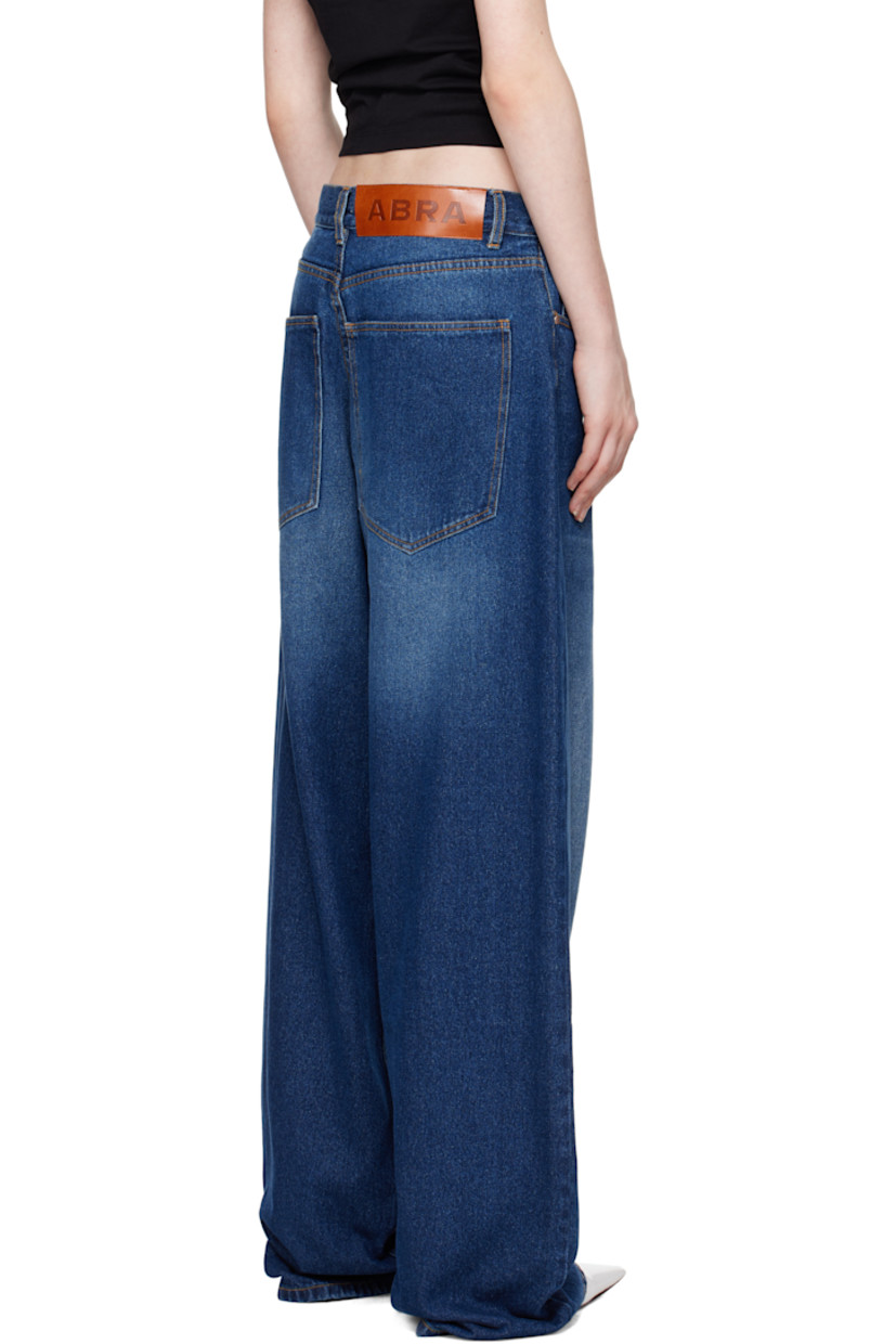 Baggy-fit stretch denim jeans. Fading and whiskering throughout. 

· Belt loops
· Five-pocket styling
· Zip-fly
· Leather logo patch at back waistband
· Logo-engraved silver-tone hardware
· Contrast stitching in tan

Supplier color: Blue