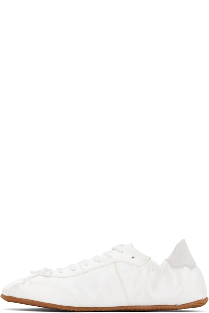 Low-top paneled satin sneakers in white. 

· Bow at vamp
· Lace-up closure
· Logo embroidered at padded tongue
· Padded and partially elasticized collar
· Logo-embroidered suede heel tab
· Twill lining
· Treaded rubber sole

Supplier color: White