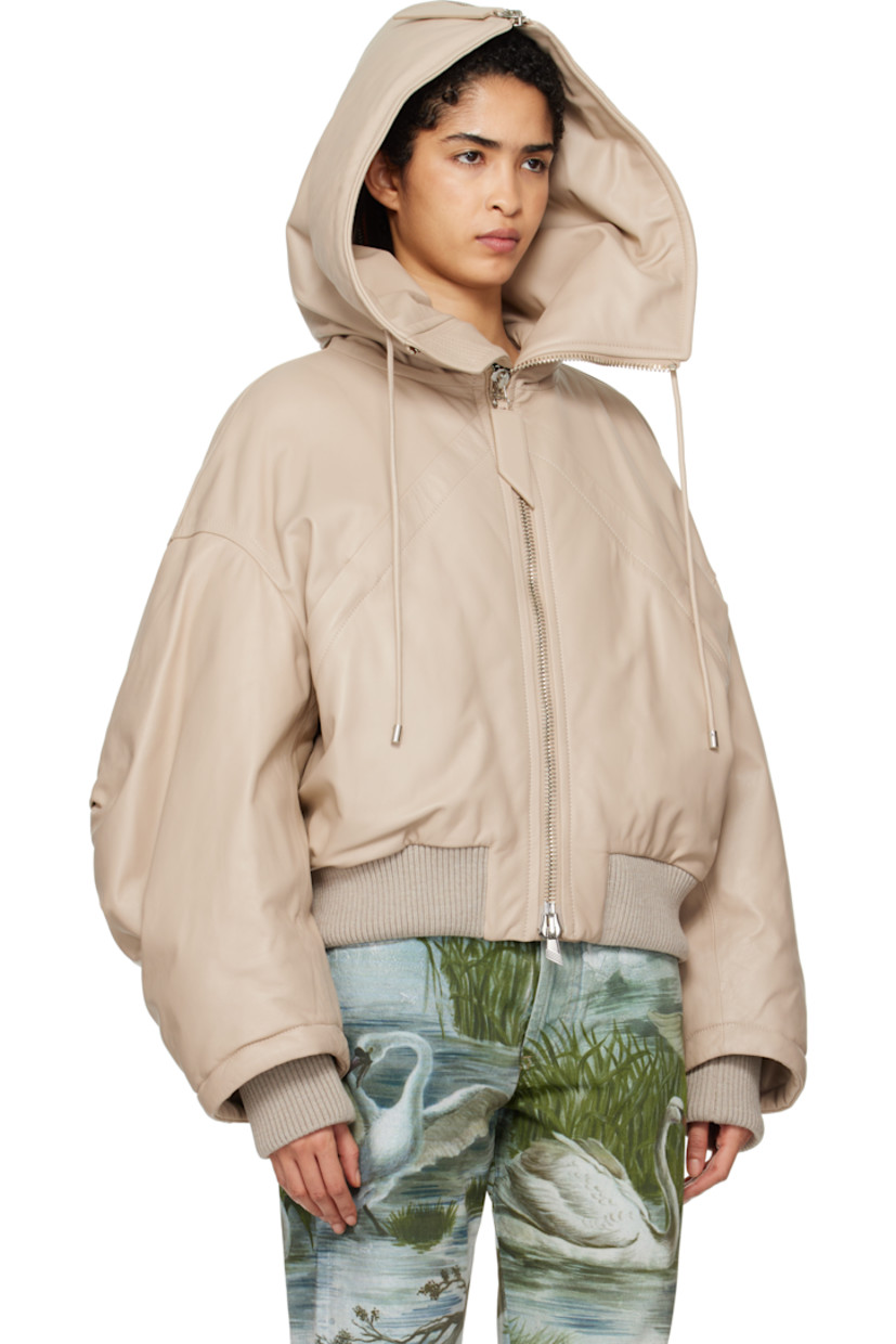 Padded buffed lambskin bomber jacket. 

· Drawstring and zip vent at hood
· Funnel neck
· Two-way zip closure
· Welt pockets
· Rib-knit hem and inset cuffs
· Dropped shoulders
· Darts at sleeves
· Welt pocket at interior
· Full logo-woven viscose twill lining

Supplier color: Ivory
