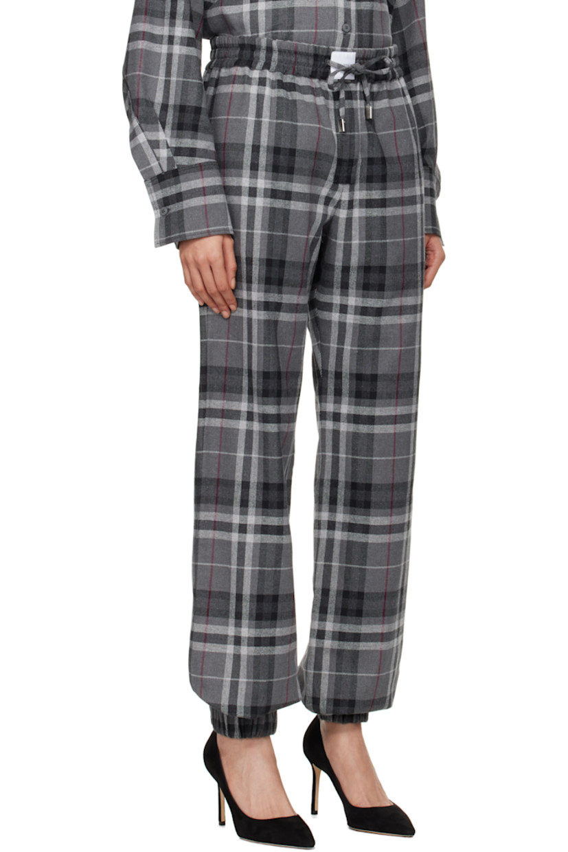 Wide-leg cotton-blend flannel trousers. Check pattern throughout. 

· Drawstring with logo hardware at elasticized waistband
· Logo patch at front waistband
· Four-pocket styling
· Mock-fly
· Elasticized cuffs

Supplier color: Grey