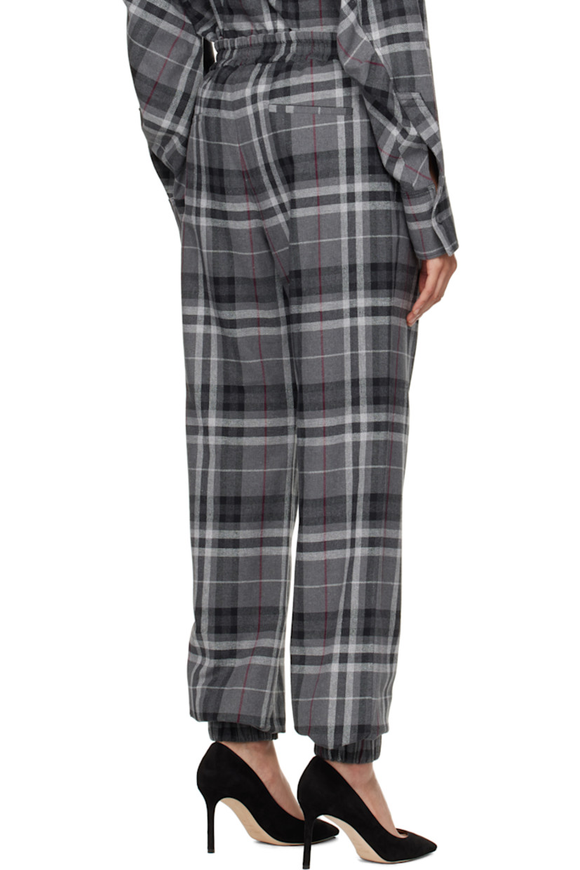 Wide-leg cotton-blend flannel trousers. Check pattern throughout. 

· Drawstring with logo hardware at elasticized waistband
· Logo patch at front waistband
· Four-pocket styling
· Mock-fly
· Elasticized cuffs

Supplier color: Grey