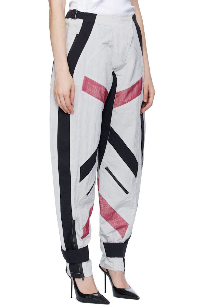 Crinkled nylon taffeta trousers.

· Cinch straps at waistband
· Two-pocket styling
· Zip fly
· Mesh panels at front and back legs
· Zip pocket at front legs
· Press-stud strap and zip vent at cuffs
· Full mesh lining

Supplier color: Multicolor