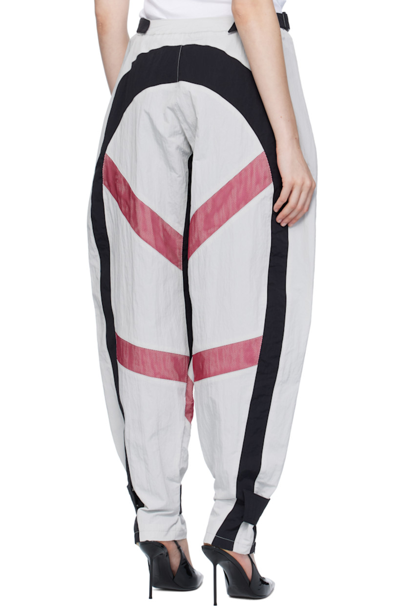 Crinkled nylon taffeta trousers.

· Cinch straps at waistband
· Two-pocket styling
· Zip fly
· Mesh panels at front and back legs
· Zip pocket at front legs
· Press-stud strap and zip vent at cuffs
· Full mesh lining

Supplier color: Multicolor