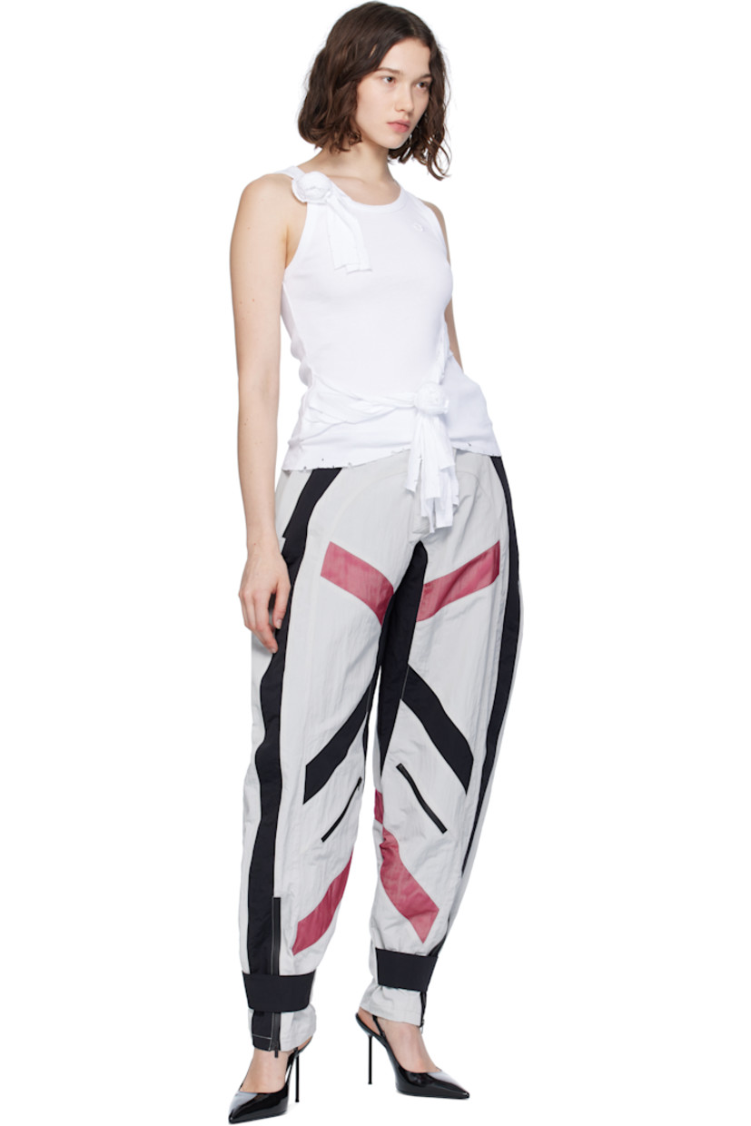 Crinkled nylon taffeta trousers.

· Cinch straps at waistband
· Two-pocket styling
· Zip fly
· Mesh panels at front and back legs
· Zip pocket at front legs
· Press-stud strap and zip vent at cuffs
· Full mesh lining

Supplier color: Multicolor
