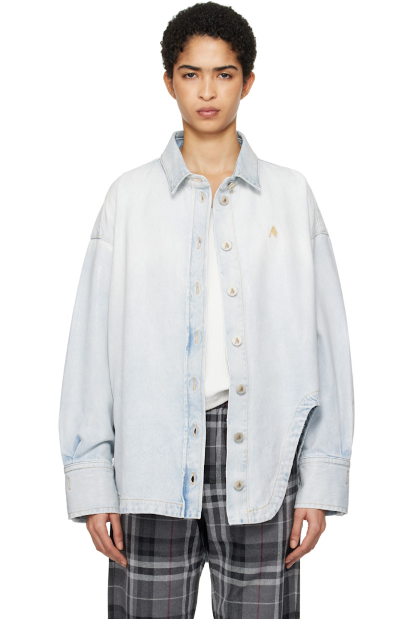 Coated non-stretch denim shirt. Fading throughout. 

· Spread collar
· Button closure
· Logo embroidered at chest
· Asymmetric shirttail hem 
· Dropped shoulders
· Pleats at two-button barrel cuffs
· Box pleat at back yoke
· Logo-engraved antiqued silver-tone hardware
· Contrast stitching in tan

Supplier color: Sky blue