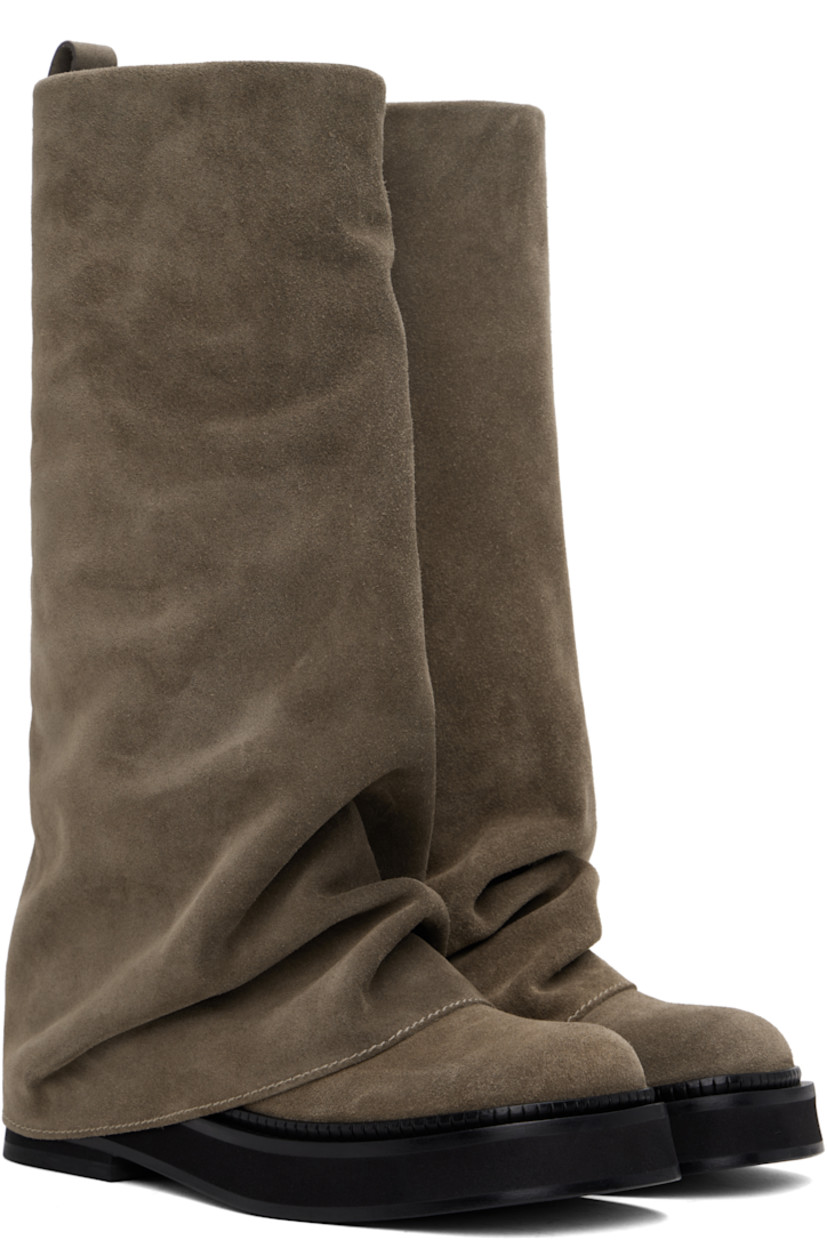 Mid-calf suede boots in taupe.

· Layered construction
· Square toe
· Pull-loop and logo hardware at heel collar
· Buffed calfskin lining
· Serrated edge at welt
· Stacked leather and rubber midsole and heel
· Leather sole
· Heel: H1.75"

Supplier color: Taupe