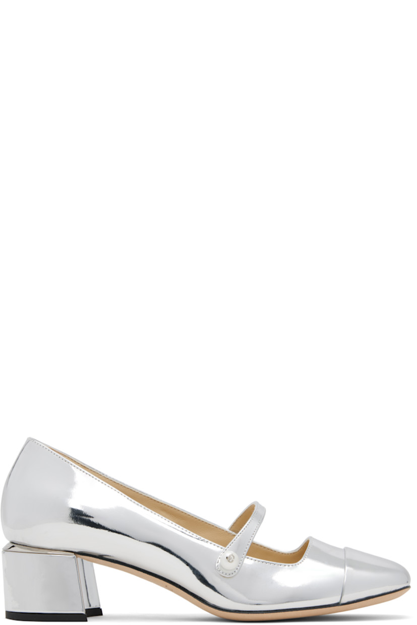 Patent leather heels.

· Square cap toe
· Faux-pearl and logo hardware at fixed strap
· Logo plaque at heel counter
· Covered block heel with rubber injection
· Nubuck sole
· Heel: H1.75"

Supplier color: Silver