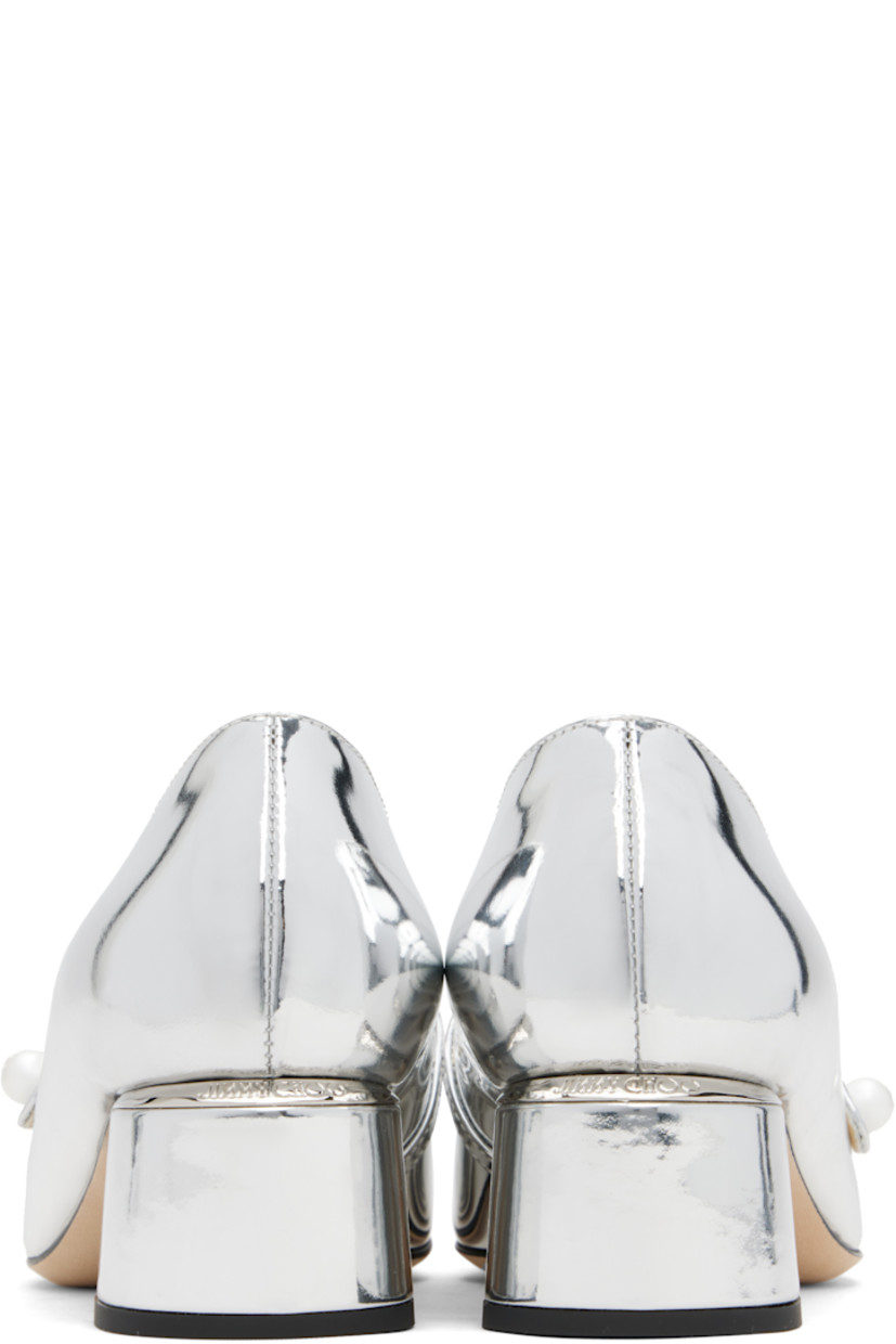 Patent leather heels.

· Square cap toe
· Faux-pearl and logo hardware at fixed strap
· Logo plaque at heel counter
· Covered block heel with rubber injection
· Nubuck sole
· Heel: H1.75"

Supplier color: Silver
