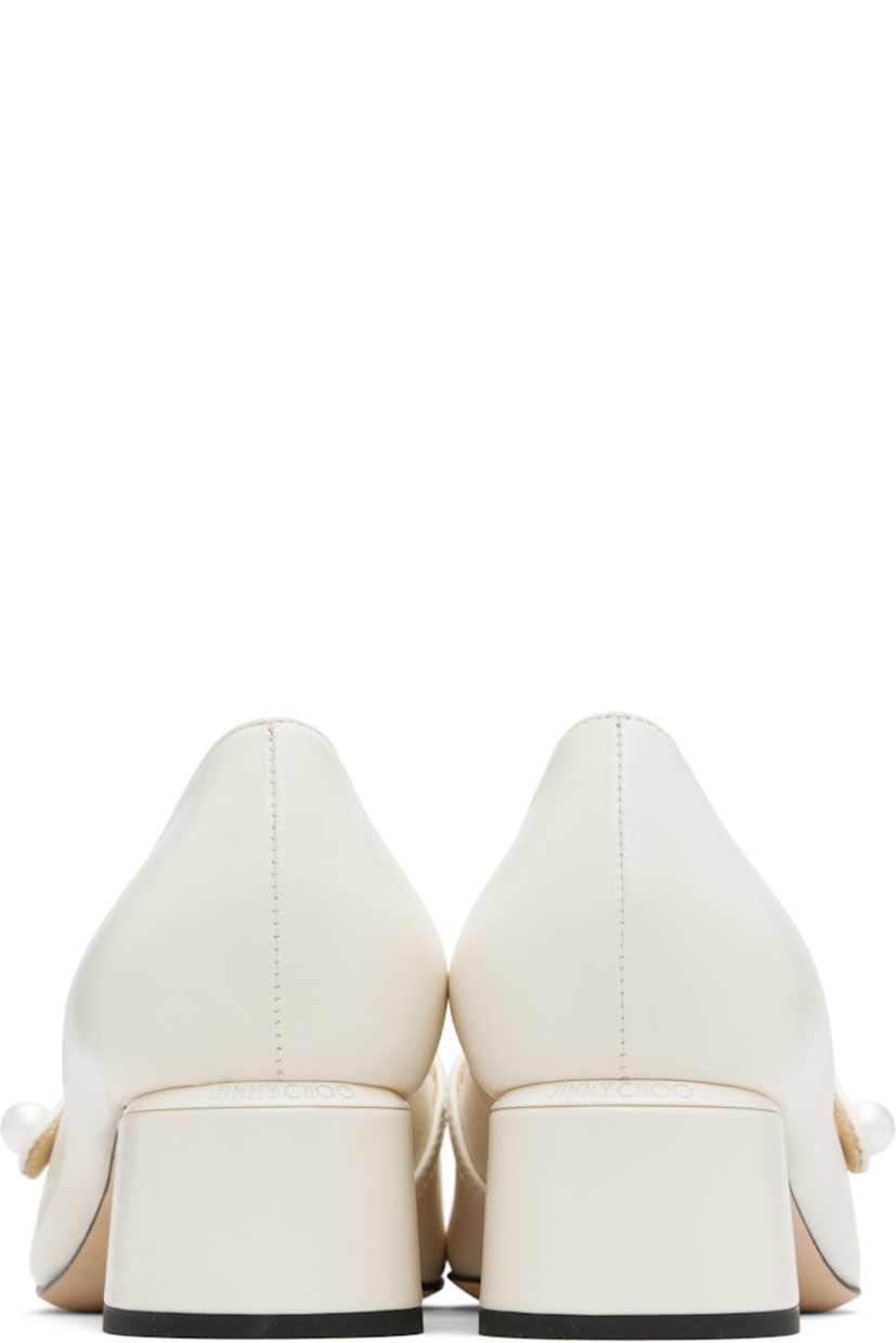 Grained nappa leather heels.

· Square patent leather cap toe
· Faux-pearl and logo hardware at fixed strap
· Logo plaque at heel counter
· Covered block heel with rubber injection
· Nubuck sole
· Heel: H1.75"

Supplier color: Latte/Latte