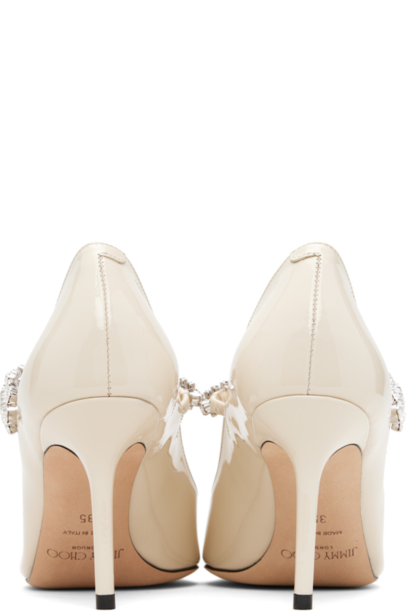 Patent leather heels.

· Pointed toe
· Crystal-cut accents at fixed strap
· Covered stiletto heel
· Nubuck sole
· Heel: H3.25"

Supplier color: Linen