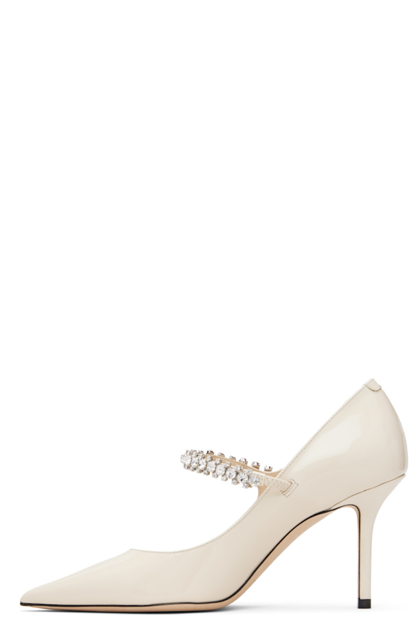 Patent leather heels.

· Pointed toe
· Crystal-cut accents at fixed strap
· Covered stiletto heel
· Nubuck sole
· Heel: H3.25"

Supplier color: Linen