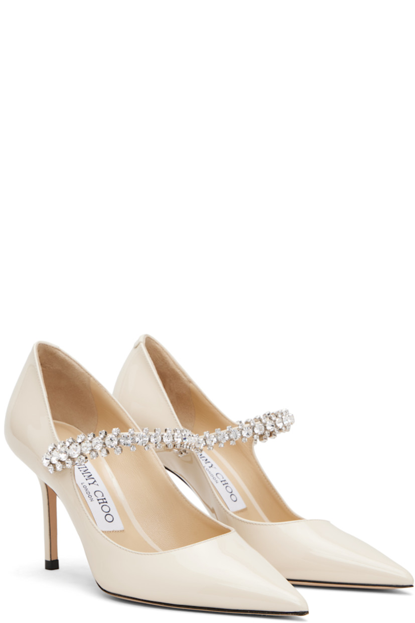 Patent leather heels.

· Pointed toe
· Crystal-cut accents at fixed strap
· Covered stiletto heel
· Nubuck sole
· Heel: H3.25"

Supplier color: Linen