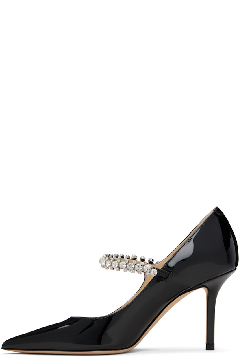 Patent leather heels.

· Pointed toe
· Crystal-cut accents at fixed strap
· Covered stiletto heel
· Nubuck sole
· Heel: H3.25"

Supplier color: Black