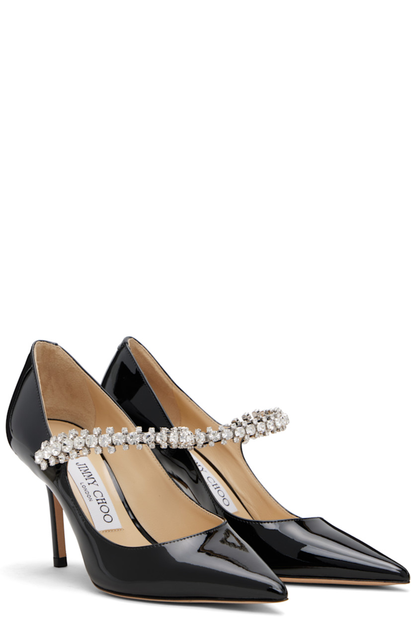 Patent leather heels.

· Pointed toe
· Crystal-cut accents at fixed strap
· Covered stiletto heel
· Nubuck sole
· Heel: H3.25"

Supplier color: Black
