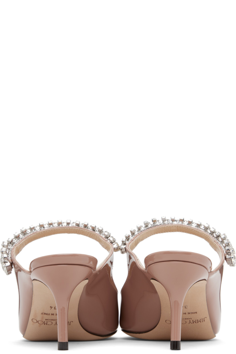 Patent leather mules.

· Pointed toe
· Crystal-cut accents at fixed strap
· Logo patch at grained leather footbed
· Covered stiletto heel
· Nubuck sole
· Heel: H2.5"

Supplier color: Ballet pink