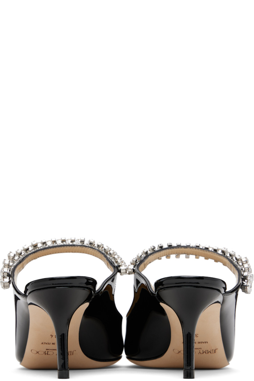 Patent leather mules.

· Pointed toe
· Crystal-cut accents at fixed strap
· Logo patch at grained leather footbed
· Covered stiletto heel
· Nubuck sole
· Heel: H2.5"

Supplier color: Black