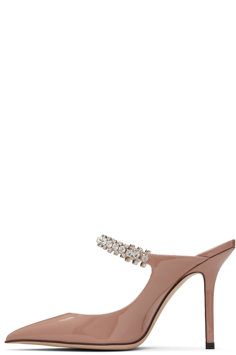 Patent leather mules.

· Pointed toe
· Crystal-cut accents at fixed strap
· Logo patch at grained leather footbed
· Covered stiletto heel
· Nubuck sole
· Heel: H4"

Supplier color: Ballet pink