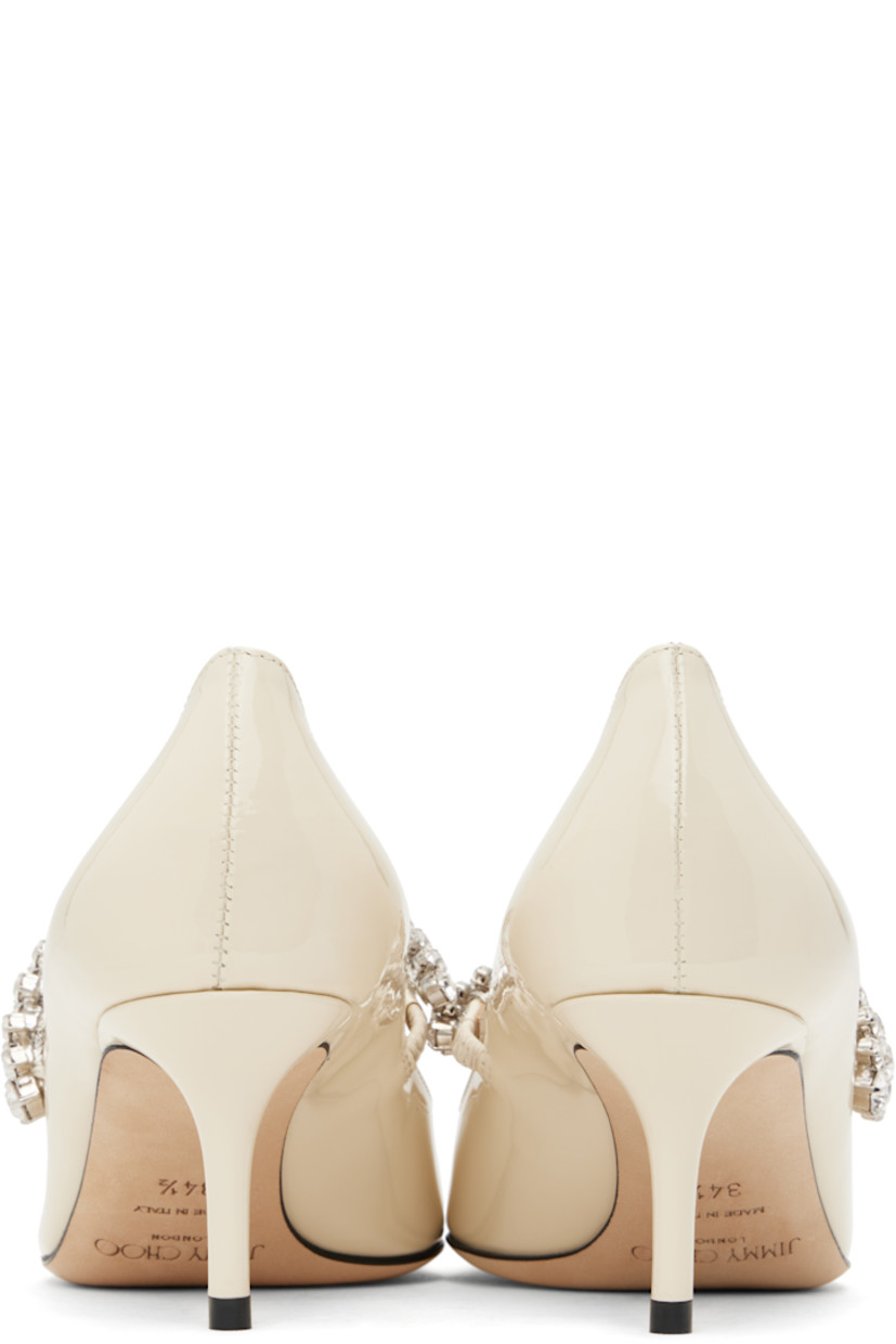 Patent leather heels in beige.

· Pointed toe
· Crystal-cut strap at vamp
· Suede and buffed leather lining
· Covered kitten heel with rubber injection
· Nubuck sole
· Heel: H2.5"

Supplier color: Linen
