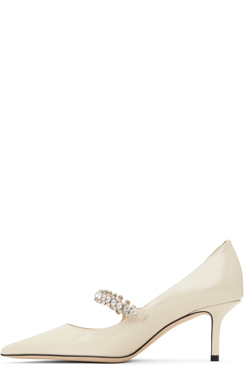 Patent leather heels in beige.

· Pointed toe
· Crystal-cut strap at vamp
· Suede and buffed leather lining
· Covered kitten heel with rubber injection
· Nubuck sole
· Heel: H2.5"

Supplier color: Linen