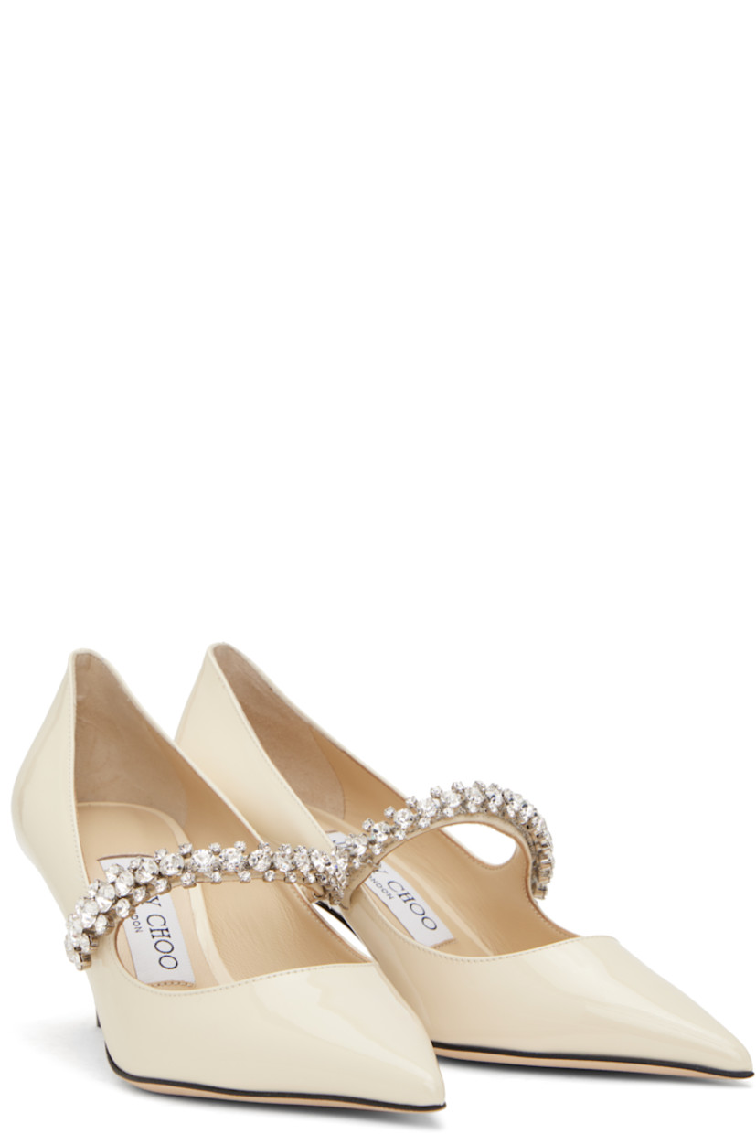 Patent leather heels in beige.

· Pointed toe
· Crystal-cut strap at vamp
· Suede and buffed leather lining
· Covered kitten heel with rubber injection
· Nubuck sole
· Heel: H2.5"

Supplier color: Linen