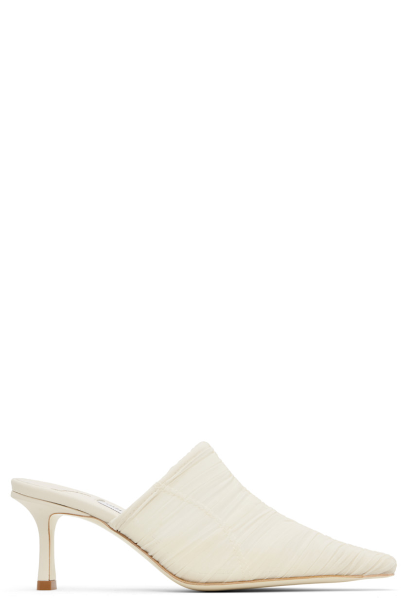 Semi-sheer ruched tulle mules in off-white.

· Pointed square toe
· Covered heel with rubber injection
· Leather sole
· Heel: H2.5"

Supplier color: Ivory