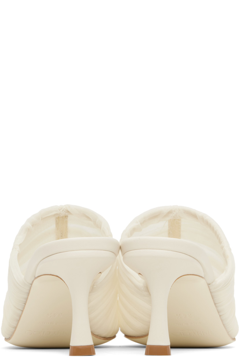 Semi-sheer ruched tulle mules in off-white.

· Pointed square toe
· Covered heel with rubber injection
· Leather sole
· Heel: H2.5"

Supplier color: Ivory